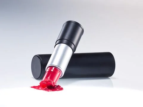 Any of various colored lipstick in a case made of black plastic and steel. Stock Photos