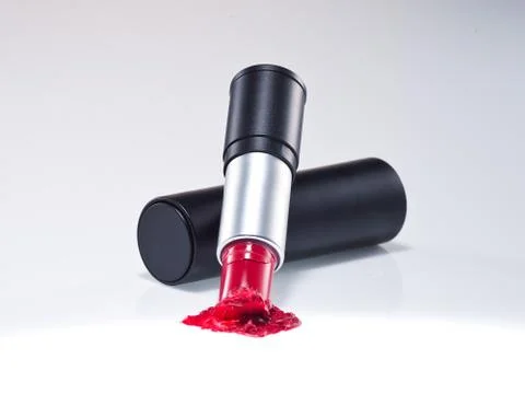 Any of various colored lipstick in a case made of black plastic and steel. Stock Photos