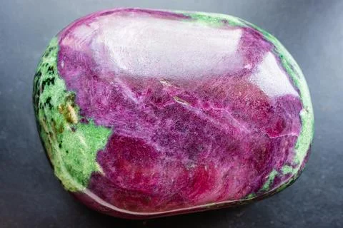 Anyolite, ruby in zoisite rock close-up on black Stock Photos