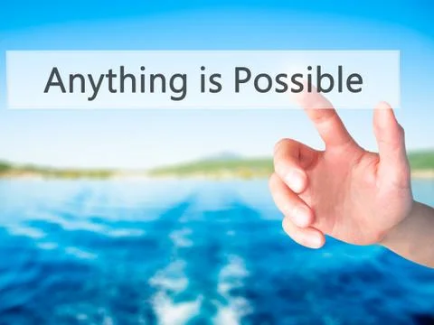 Anything is Possible - Hand pressing a button on blurred background concept o Stock-Fotos