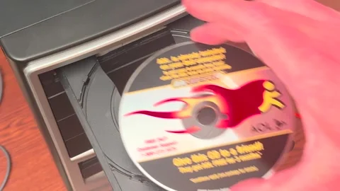 AOL , America Online CD Placed in CD tray - Bettendorf, IA, June 12, 2024 Stock Footage 277404991