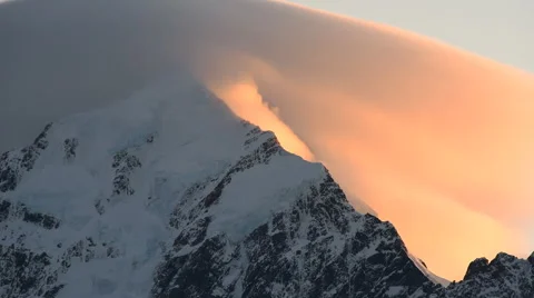 Aoraki, Mount Cook peak with mist forming over mountain peak on sunrise Stock Footage 69035677