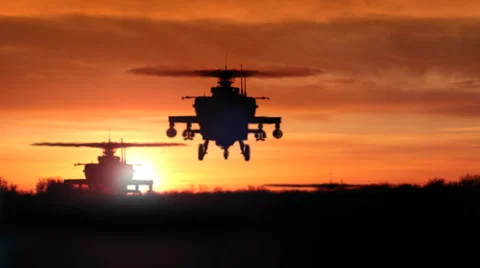 Apache AH-64 Gunship Helicopters Rising Over Ridge Stock Footage