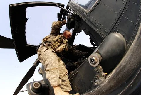 An Apache attack helicopter pilot serving in Iraq with the Enhanced Combat... Stock Photos