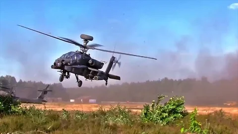 Apache helicopter flying away 1 Stock Footage 96320300