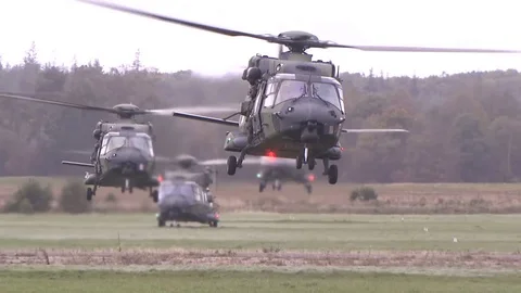 Apache Helicopters Take Off and Plan Above Ground, US Armed Forces Stock Footage 120948414