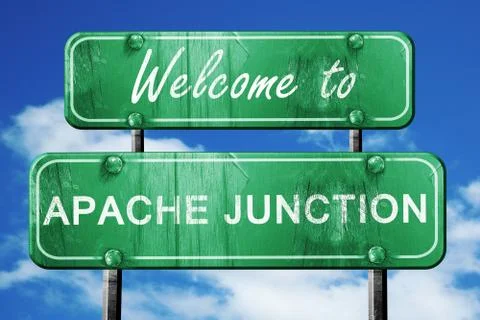 Apache junction vintage green road sign with blue sky background Stock Illustration