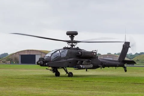 Apache lifts off from the grass Stock Photos