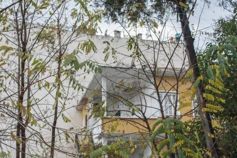 An Apartment Behind Trees Stock Photos