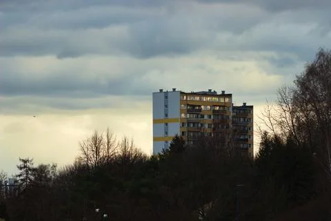 Apartment block on a background of clouds. Stock Photos