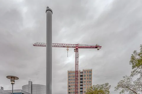Apartment block behind a heating plant chimney Stock Photos