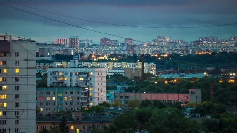 Apartment block. Illuminated flickering windows. Transitions from day to night. Stock Footage 76824878