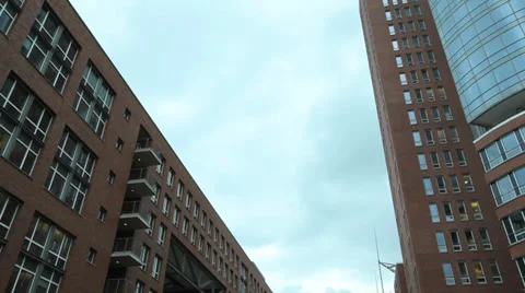 Apartment blocks lining a river Stock Footage 27352999