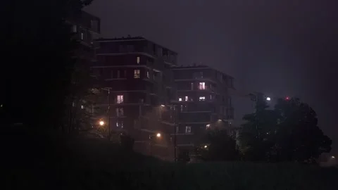 Apartment Blocks at Night Rain Stock Footage 244385656