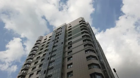 Apartment building against the sky with clouds Stock Footage 131364989