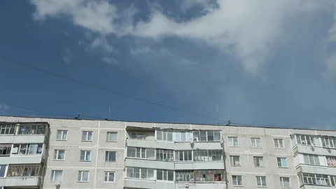 Apartment building on blue sky background Vídeos de archivo 102761629