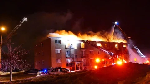 Apartment building completly burning Stock Footage 105298835