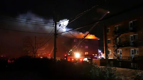 Apartment building completly on flames Stock Footage 105280064