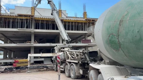 Apartment Building Construction Site with Cement Mixer Concrete Work and Tower Vídeos de archivo 346153543