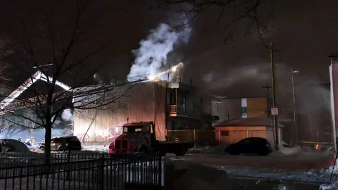 Apartment building on fire at night Stock Footage 105298043