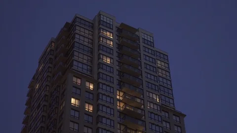 Apartment Building Office Night Establishing Shot with Matching Day Stock Footage