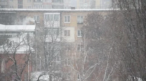 Apartment building in snowfall Stock Footage 69021233