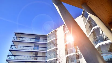 A apartment building with a unique architectural solution. Stock Photos