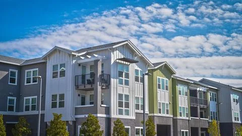 Apartment complex with clouds in the background Stock Photos