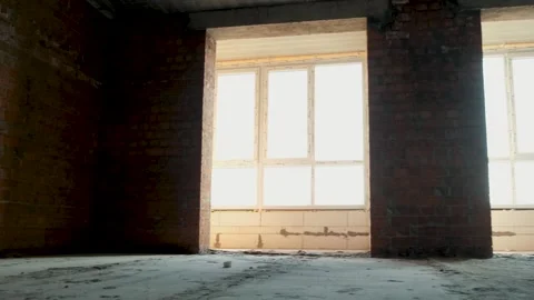 Apartment construction interior empty room with brick wall and windows Stock Footage 345748151