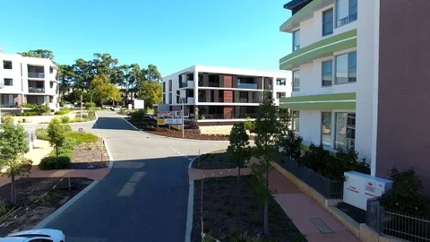 Apartment developments real estate new suburb urban flyover aerial footage Stock Footage 98121037