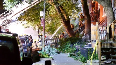 Apartment fire with tree and water Stock Footage 116078617
