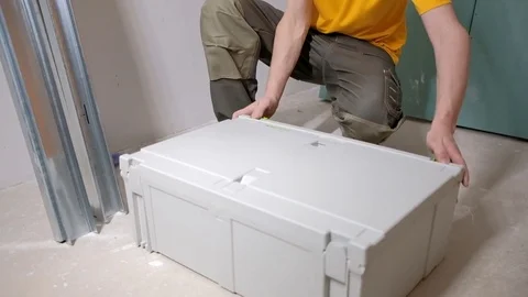 Apartment renovation.  Builder opens the box with tools. Stock Footage 84293520