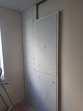 Apartment renovation using wall and ceiling soundproofing boards with miner.. Stock Photos