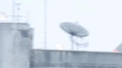 Apartment rooftop with multiple satellite dishes passing by Vidéo 331706679