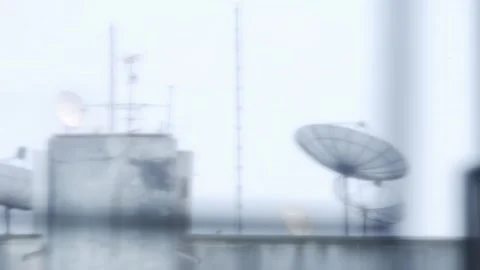 Apartment rooftop with multiple satellite dishes passing by Video stock 332293089