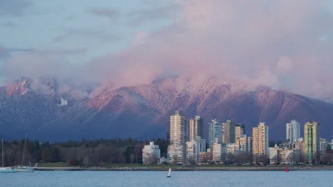 Apartment towers with winter mountain backdrop Stock Footage 297921705