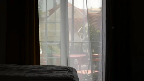 Apartment view to the street. The wind is moving the curtain. Stock Footage 248464679