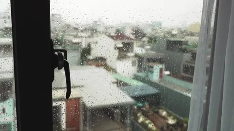 Apartment Window Frame with Rainy Blurred Cityscape View and overcast sky Video stock 339286043