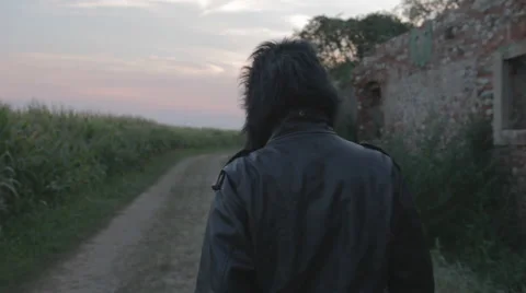 Ape Man Walking Through a Cornfield #2 Stock Footage 58120889