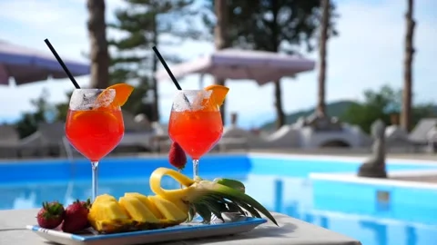 Aperitif by the pool. Glass of Spritz with snacks Stock Footage