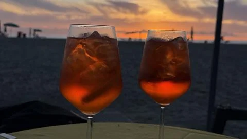 Aperitif at Sunset on the Beach with Drinks Stock Photos