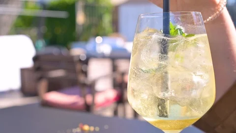 Aperol cocktail on a table in a cafe on the background of the sea. Stock Footage 127198169