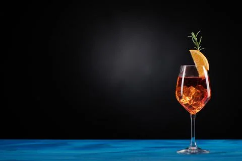 An Aperol Spritz with ice on the table Stock Photos