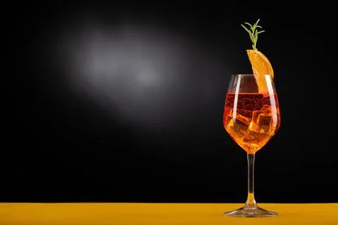 An Aperol Spritz with ice on the table Stock Photos