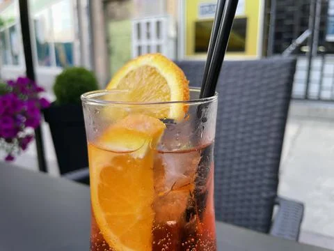 Aperol spritz with orange slice at outside cafe Aperol is an Italian aperitif Stock Photos