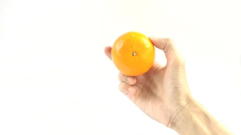 APerson Holds An Orange Stock Footage 296723418