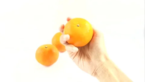 APerson Holds An Orange Stock Footage 296723439