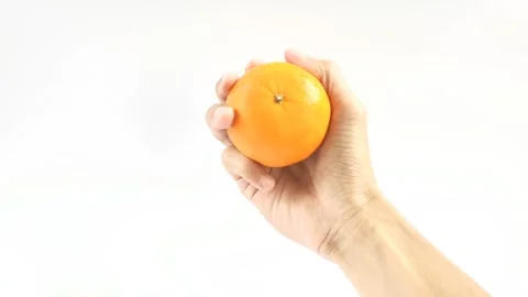 APerson Holds An Orange Stock Footage 296723440