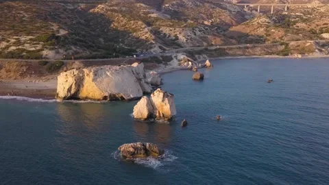 Aphrodite rock at sunset on Paphos Cyprus - aerial view Stock Footage 142575397
