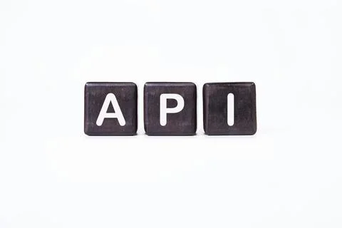API abbreviation, modern technology concept. API It is written on dark cubes  Foto stock